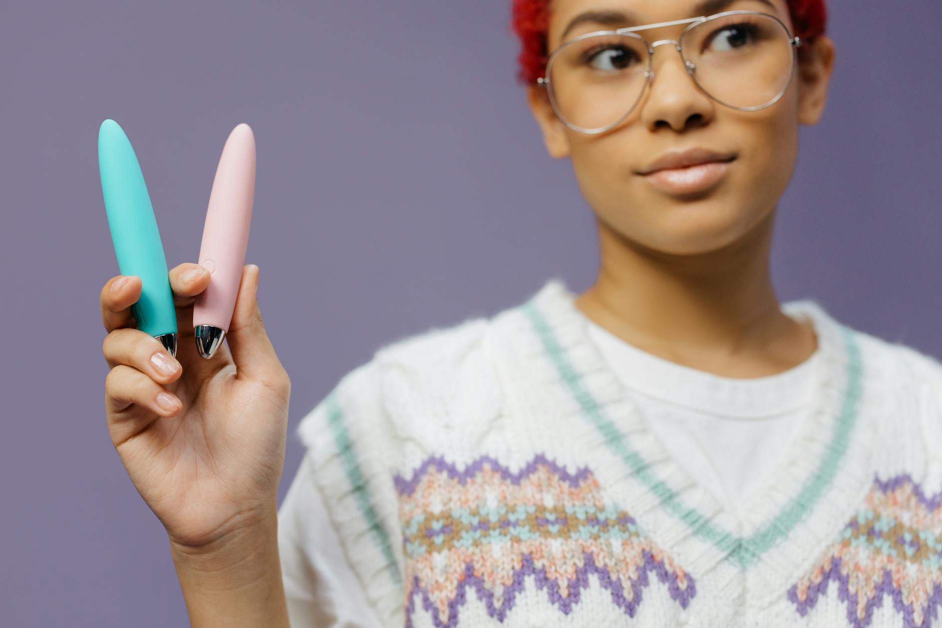 Person holding lemon vibrators, representing solo pleasure and self-discovery after being single again.