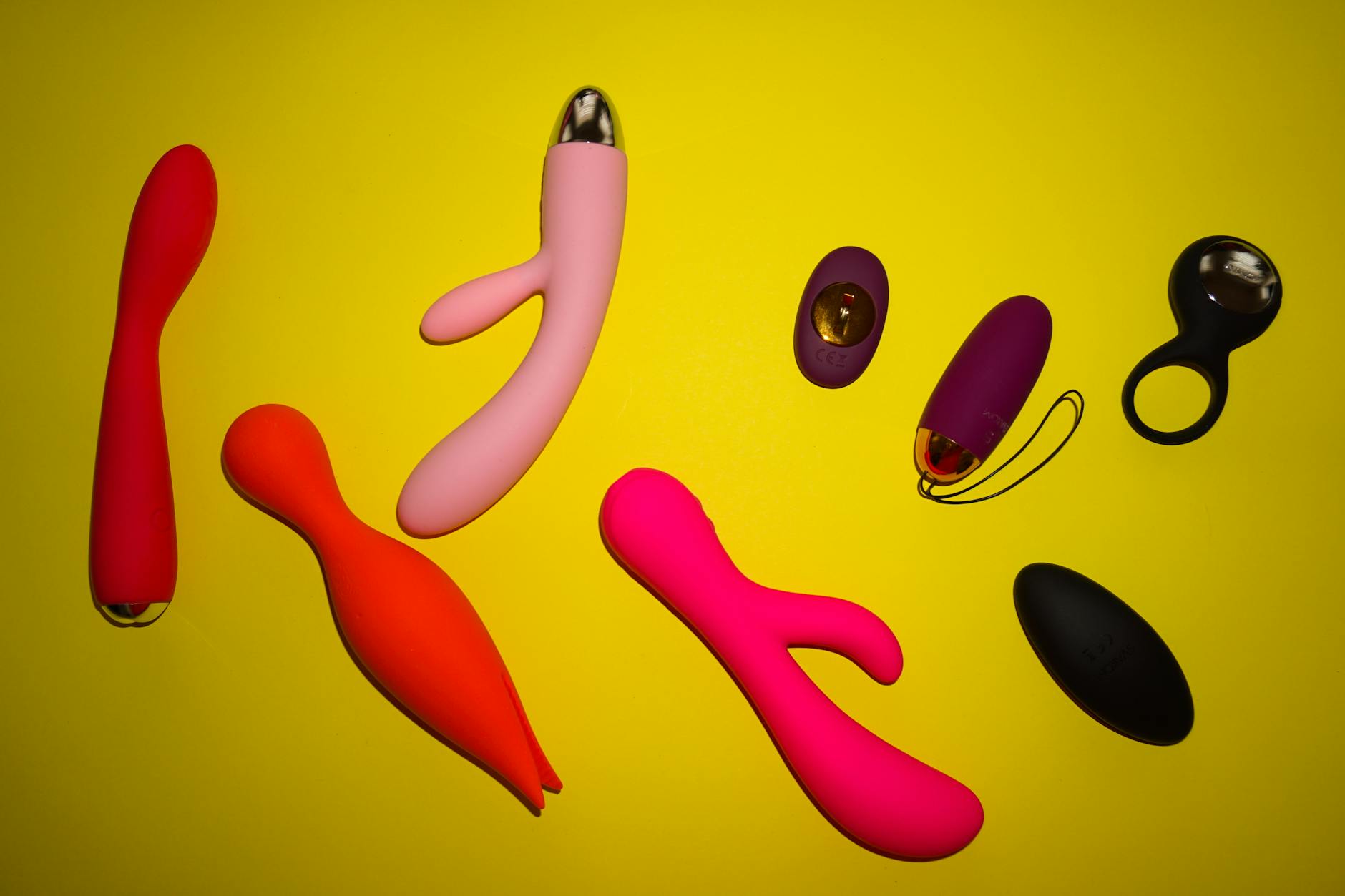 Blue silicone vibrator held in hand, showing accessible design for pleasure during difficult seasons