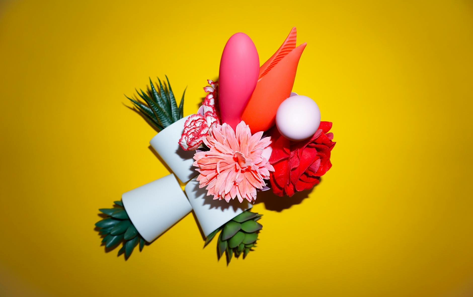 A person thoughtfully holding a vibrator, representing modern approaches to shared pleasure and intimacy